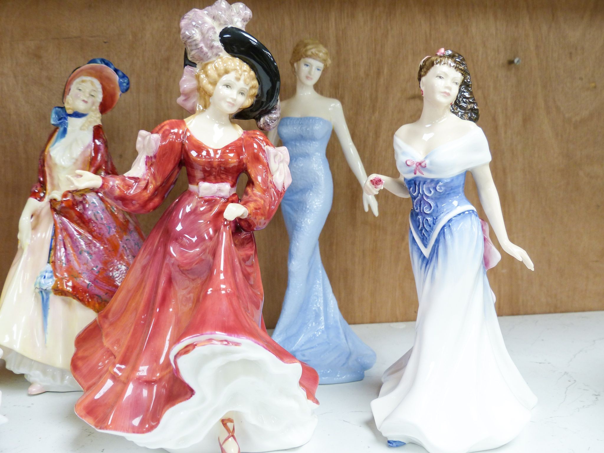 Seven Royal Doulton figurines: Carrie HN2800, Jacqueline HN2000, For You HN3754, Diana Princess of Wales HN5061, Belle HN3703, Patricia HN3365, Paisley Shawl HN1987